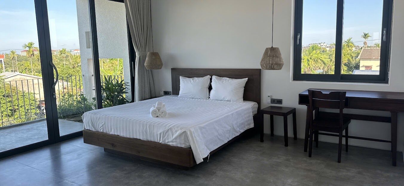Open-plan living room with natural light at Hoi An Breeze Villa